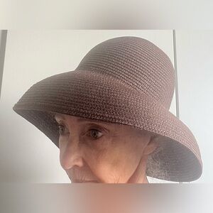 Never worn like new! Woven straw hat. Brown. Stunning color.